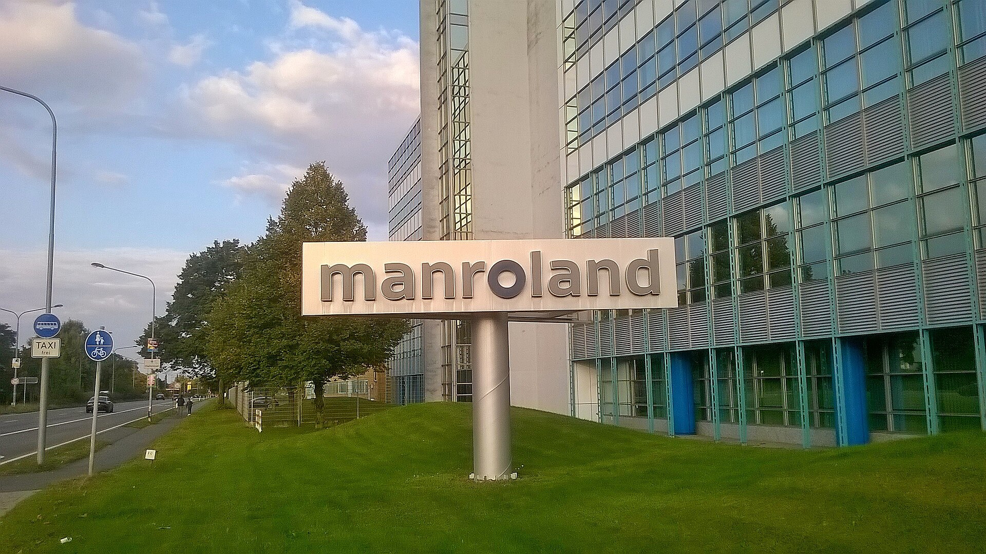 Imagem de referência relacionada a Manroland, item descrito como registro de referência sobre Manroland, organizado a partir de dados estruturados abertos